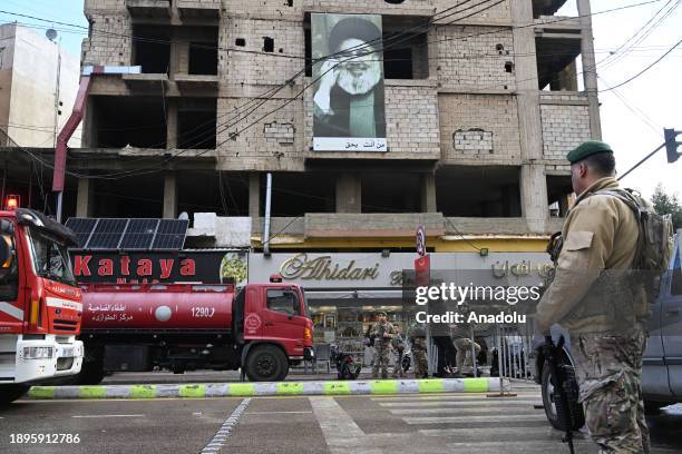 Security forces take measures around the building where the Hamas office is located following Israeli attack in which Hamas deputy leader Saleh...