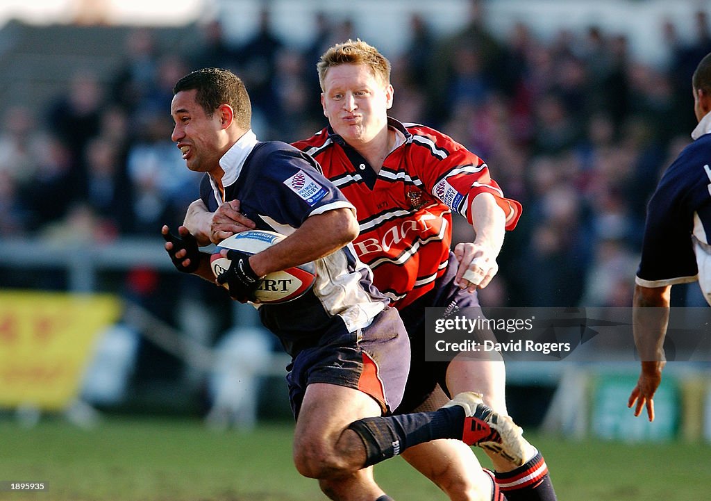 Shane Drahm of Bristol is tackled by Chris Catling of Gloucester