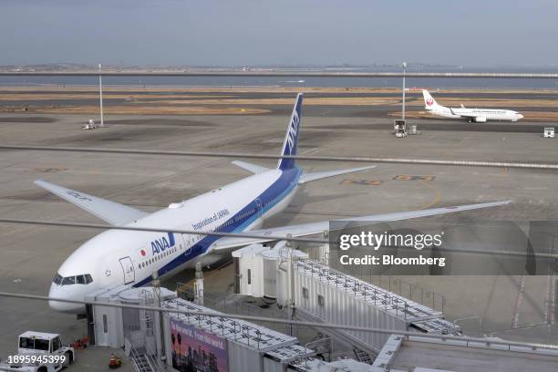 An All Nippon Airways Co. , left, and Japan Airlines Co. Aircraft at Haneda Airport in Tokyo, Japan, on Wednesday, Jan 3, 2024. All 379 people aboard...