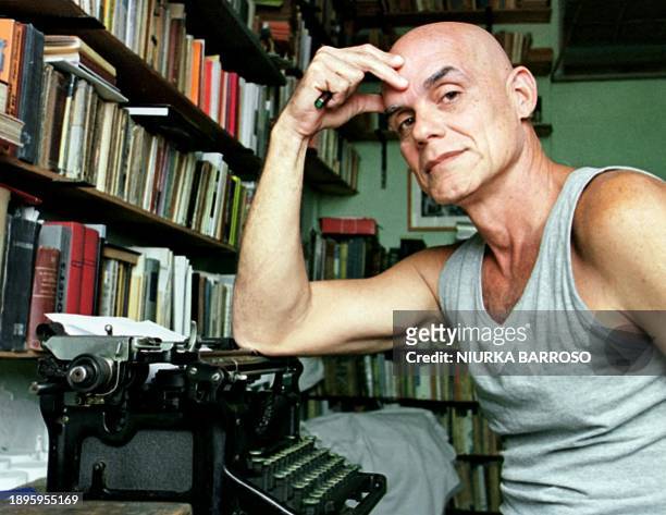 Cuban novelist Pedro Juan Gutierrez , winner of the Alfonso Garcia-Ramos prize, poses next to his old typewriter at Guiterrez's house in Center...