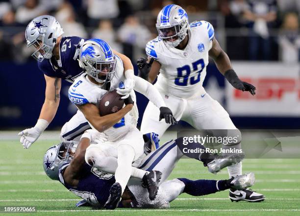 Ifeatu Melifonwu of the Detroit Lions is tackled after intercepting a pass thrown by Dak Prescott of the Dallas Cowboys during the first quarter in...