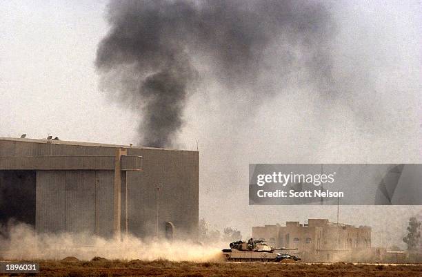 Army 3rd Division tank rolls across the tarmac of Baghdad International airport during an allied advance April 4, 2003 on the Iraqi capital. U.S. And...