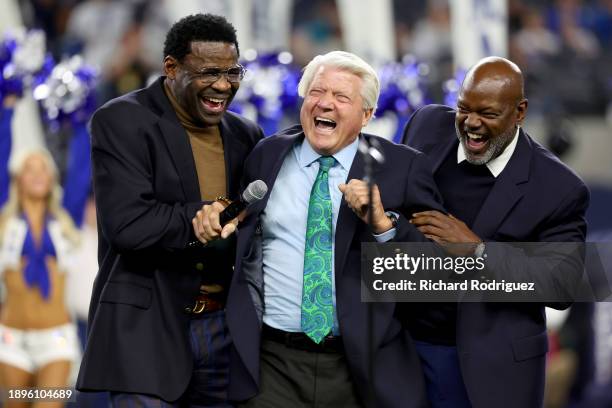 Former head coach Jimmy Johnson jokes around with former players Michael Irvin and Emmitt Smith during the Dallas Cowboys Ring of Honor ceremony at...