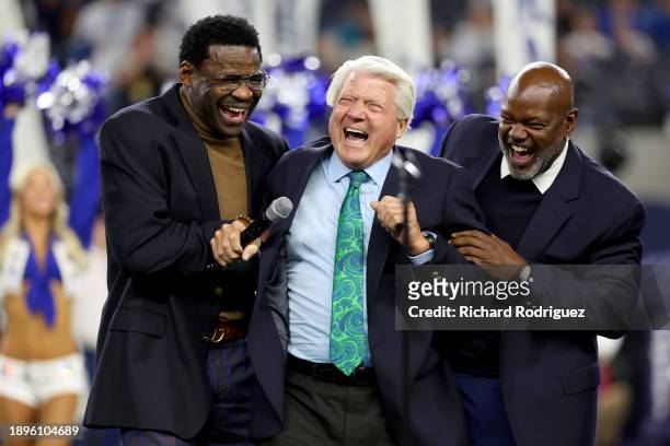 Former head coach Jimmy Johnson jokes around with former players Michael Irvin and Emmitt Smith during the Dallas Cowboys Ring of Honor ceremony at...