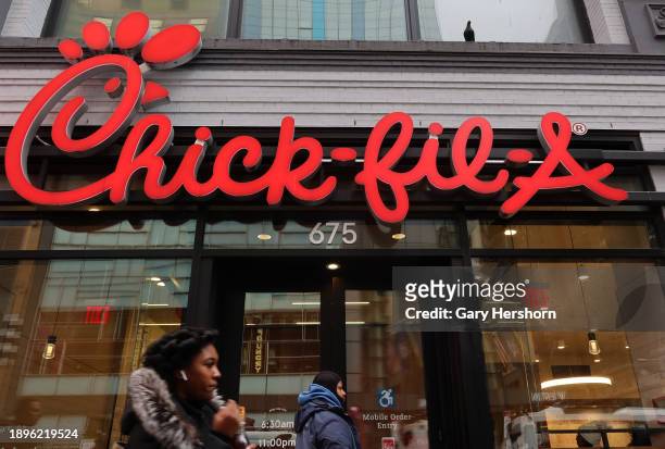 People walk past a Chick-fil-A restaurant on 8th Avenue on December 30 in New York City.