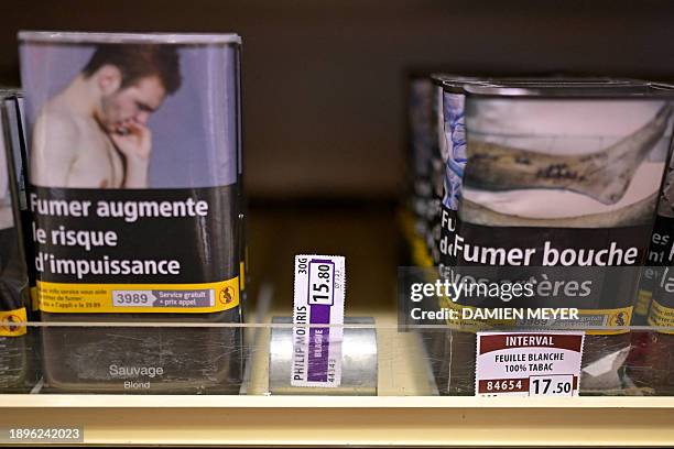 Cigarette packets are displayed in a tobacconist's shop in Hede-Bazouges, western France on January 2, 2024. Tobacconists were expecting cigarette...