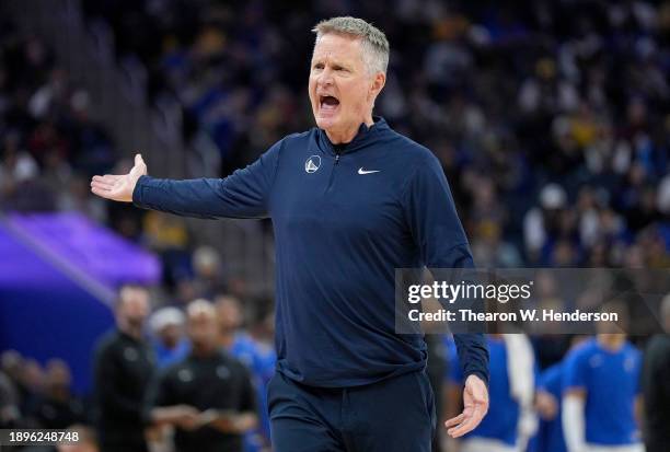 Head coach Steve Kerr of the Golden State Warriors reacts to the officials on a no foul call on his player Stephen Curry against the Dallas Mavericks...