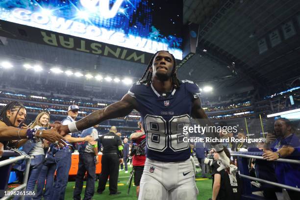 CeeDee Lamb of the Dallas Cowboys celebrates with fans after defeating the Detroit Lions in the game at AT&T Stadium on December 30, 2023 in...