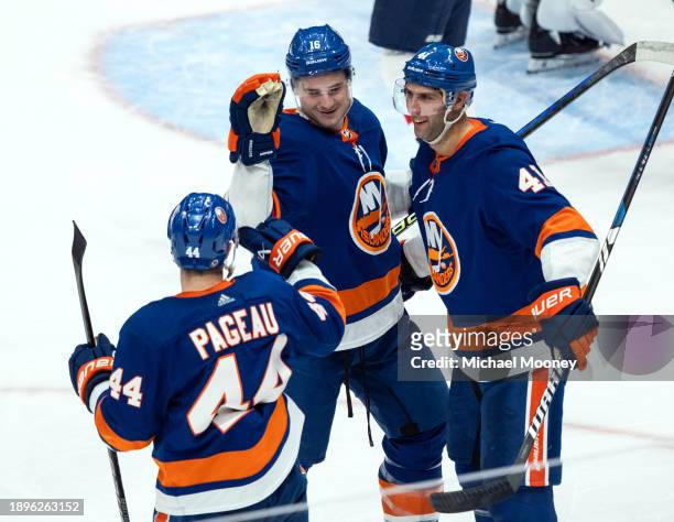 Julien Gauthier of the New York Islanders celebrates his third period goal with teammates during a game against the Washington Capitals at UBS Arena...