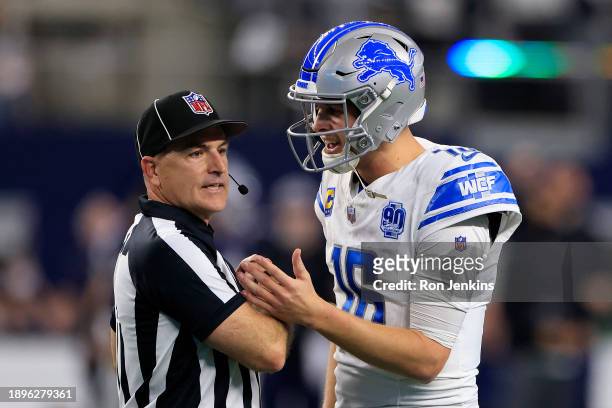 Jared Goff of the Detroit Lions argues a call with field judge Nate Jones against the Dallas Cowboys during the fourth quarter in the game at AT&T...