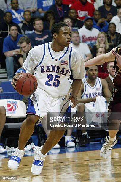 Michael Lee of Kansas drives during the NCAA Tournament against Arizona State at the Ford Center March 22, 2003 in Oklahoma City, Oklahoma. Kansas...