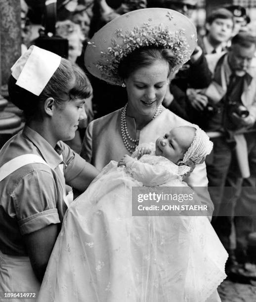 Picture taken in the year 1968 shows then Crown Princess Margrethe of Denmark with her baby Prince Frederik of Denmark during his baptism at Holmens...