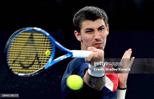 Alexei Popyrin of Australia plays a forehand in his match against Christopher O’Connell of Australia during day one of the 2024 Brisbane...