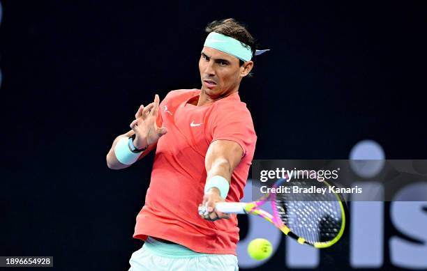 Rafael Nadal of Spain plays a forehand in his doubles match with Marc Lopez of Spain against Max Purcell and Jordan Thompson of Australia during day...