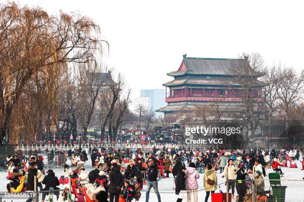 People enjoy ice-skating at Shichahai Ice Rink during the three-day New Year's Day holiday on December 30, 2023 in Beijing, China.