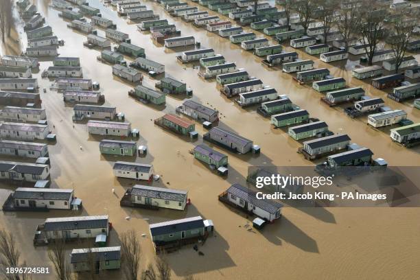 Holiday homes at the Billing Aquadrome in Northampton surrounded by water due to rising water caused by Storm Henk. A severe flood alert, meaning...