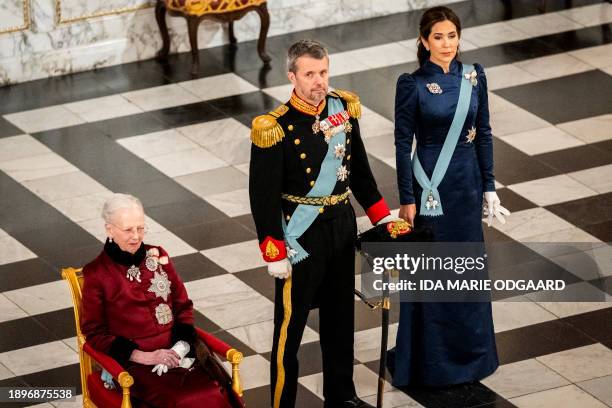Queen Margrethe II of Denmark, Crown Prince Frederik of Denmark and Crown Princess Mary of Denmark greet the diplomatic corps during a New Year...