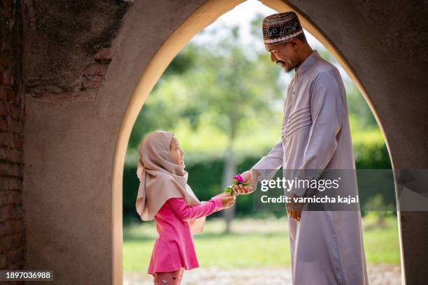 muslim family, father and daughter in an old mosque. - ramadan prayer stock pictures, royalty-free photos & images