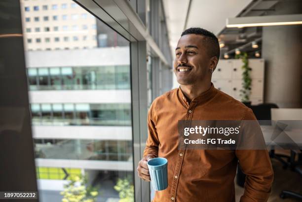 businessman contemplating on the office - looking away stock pictures, royalty-free photos & images