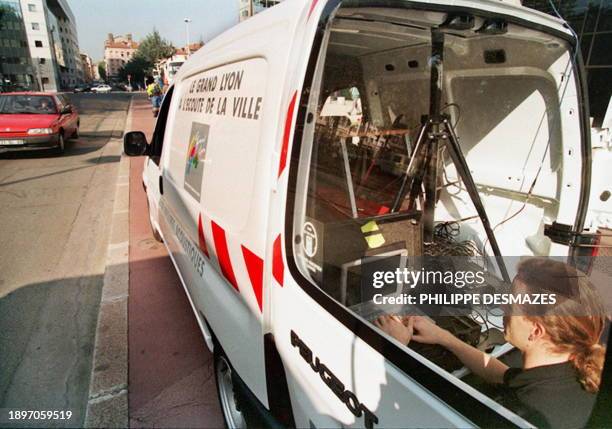 Technician evaluates the noise level using a small computer integrated into a "sonomobile", a vehicle equipped with a large mast topped with a...