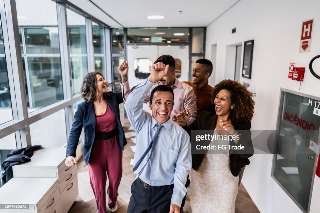 Coworkers celebrating on the office