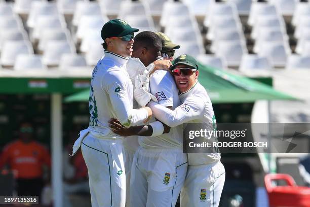 South Africa's Lungi Ngidi celebrates with teammates after the dismissal of India's Jasprit Bumrah during the first day of the second cricket Test...