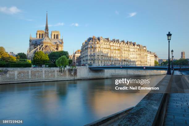 cathedral notre dame and river seine, paris france. - ile de la cite stock pictures, royalty-free photos & images