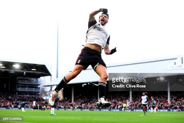Raul Jimenez of Fulham celebrates after scoring their team's first goal during the Premier League match between Fulham FC and Arsenal FC at Craven...