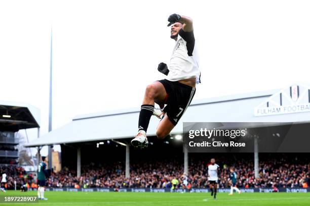 Raul Jimenez of Fulham celebrates after scoring their team's first goal during the Premier League match between Fulham FC and Arsenal FC at Craven...