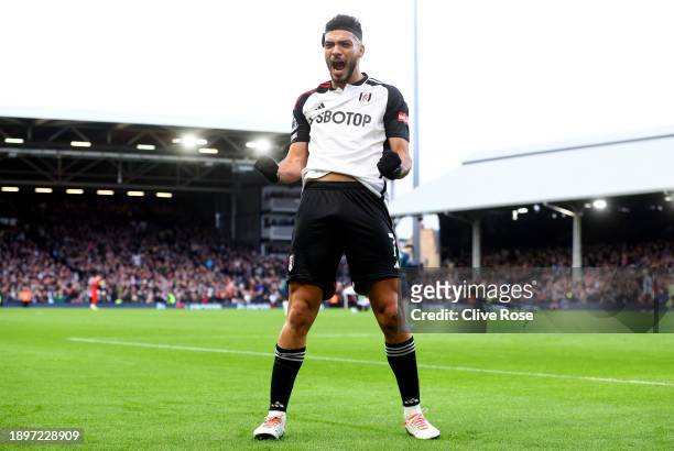 Raul Jimenez of Fulham celebrates after scoring their team's first goal during the Premier League match between Fulham FC and Arsenal FC at Craven...