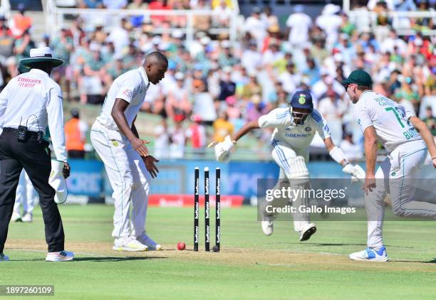 Nandre Burger of South Africa runs out Mohammed Siraj of India during day 1 of the 2nd Test match between South Africa and India at Newlands Cricket...