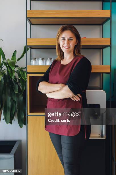 happy cafe owner: portrait of smiling business woman in coffee shop - small placard stock pictures, royalty-free photos & images