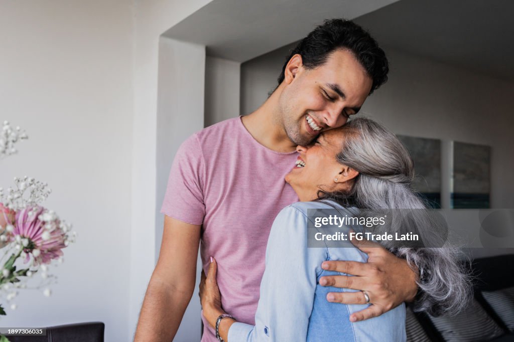 Mother and son embraced at home