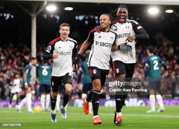 Bobby Reid of Fulham celebrates with teammate Calvin Bassey after scoring their team's second goal during the Premier League match between Fulham FC...