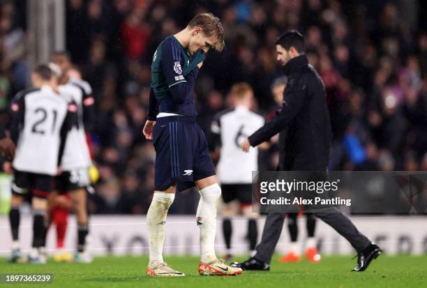 Martin Odegaard of Arsenal looks dejected following defeat after the Premier League match between Fulham FC and Arsenal FC at Craven Cottage on...