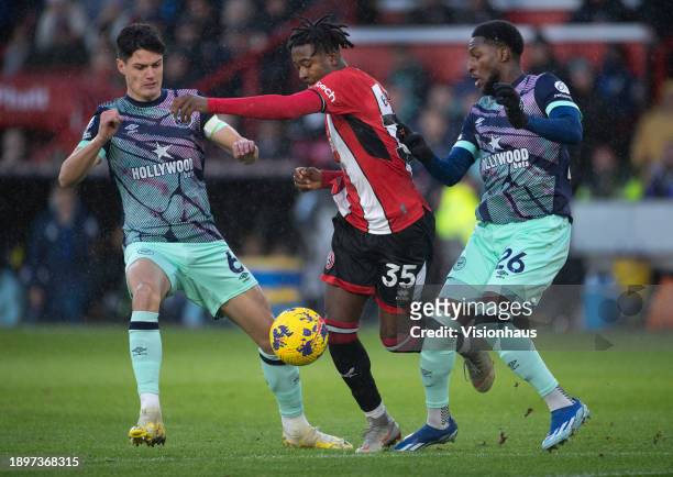 Andre Brooks of Sheffield United in action with Christian Norgaard and Shandon Baptiste of Brentford during the Premier League match between...
