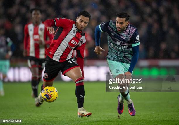 Cameron Archer of Sheffield United and Saman Ghoddos of Brentford in action during the Premier League match between Sheffield United and Brentford FC...