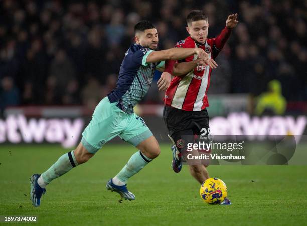 James McAtee of Sheffield United and Neal Maupay of Brentford in action during the Premier League match between Sheffield United and Brentford FC at...