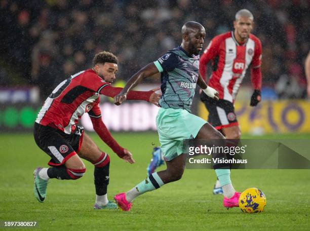 Yoane Wissa of Brentford and Jayden Bogle of Sheffield United in action during the Premier League match between Sheffield United and Brentford FC at...