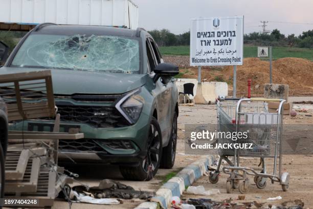 This photograph taken on January 3, 2024 shows bullet holes in a car's windshield at the Erez border crossing between southern Israel and the Gaza...