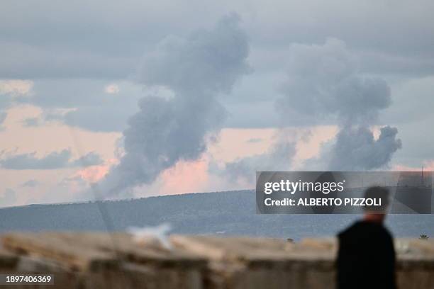 Picture taken from northern Israel shows smoke billowing from across the border in south Lebanon on January 3 amid ongoing cross-border tensions as...
