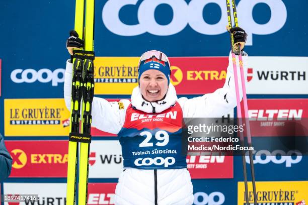 Kerttu Niskanen of Finland in first place on the podium of the 10 Km Classic on December 31, 2023 in Toblach Hochpustertal, Italy.