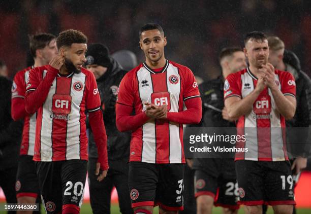 Sheffield United players Jayden Bogle, Max Lowe and Jack Robinson acknowledge the fans after the Premier League match between Sheffield United and...