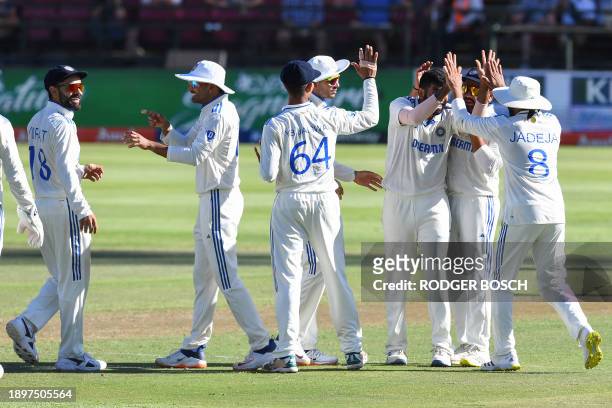 India's Jasprit Bumrah celebrates with teammates after the dismissal of South Africa's Tristan Stubbs during the first day of the second cricket Test...