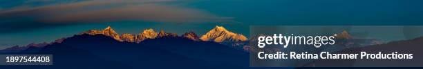 magnificent mountain panorama snowy peaks high above clouds himalayas of nepal as seen from india - himalayas sunrise stock pictures, royalty-free photos & images
