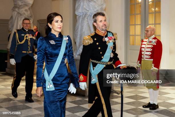 Crown Prince Frederik of Denmark and Crown Princess Mary of Denmark arrive to greet members of the diplomatic corps during a New Year reception at...