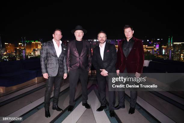 In this image released on December 31, Jeff Timmons, Justin Jeffre, Drew Lachey and Nick Lachey of 98 Degrees pose for a photo at Ghostbar as part of...