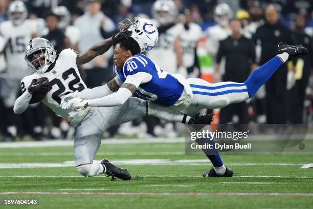 Ameer Abdullah of the Las Vegas Raiders is tackled by Jaylon Jones of the Indianapolis Colts during the first quarter at Lucas Oil Stadium on...