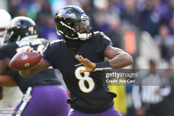 Lamar Jackson of the Baltimore Ravens throws a pass against the Miami Dolphins during the first quarter of the game at M&T Bank Stadium on December...