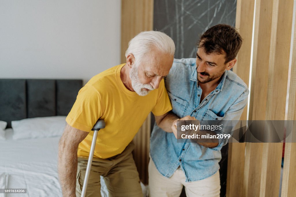 Son helping his father